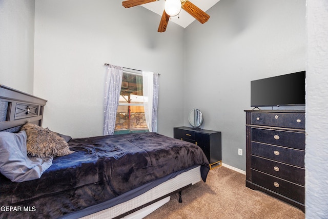 carpeted bedroom with ceiling fan and lofted ceiling