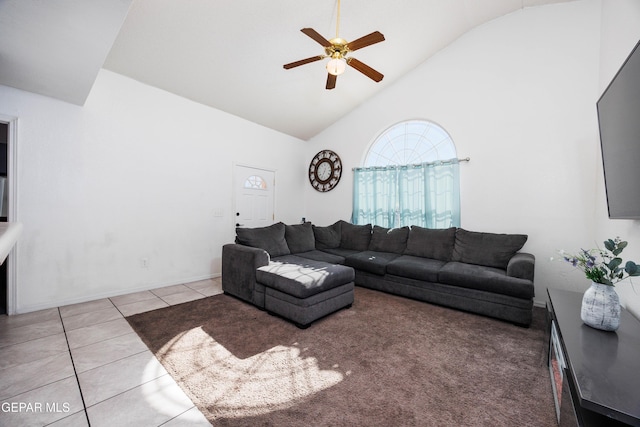 living room featuring ceiling fan, light tile patterned floors, and high vaulted ceiling