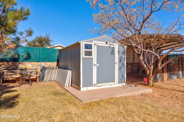 view of outbuilding with a lawn