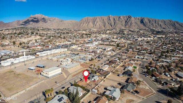 birds eye view of property featuring a mountain view