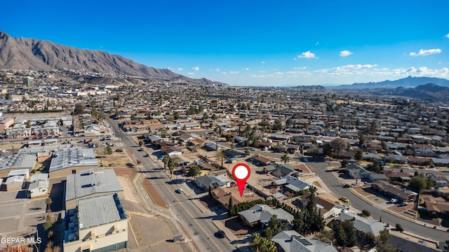 birds eye view of property with a mountain view