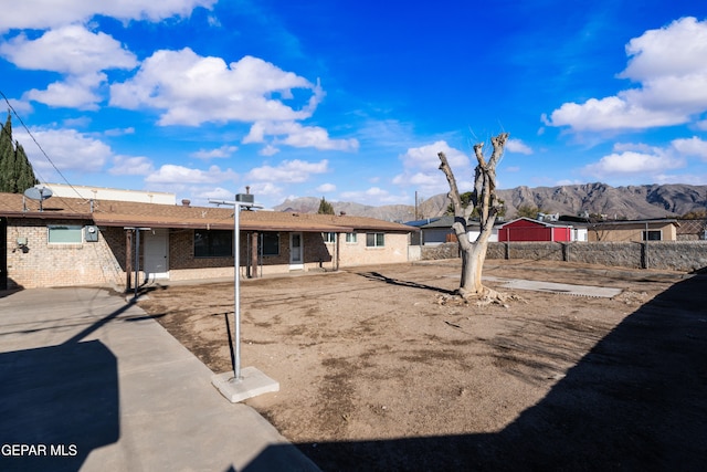 rear view of property featuring a mountain view