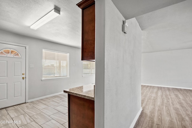 foyer with light hardwood / wood-style floors