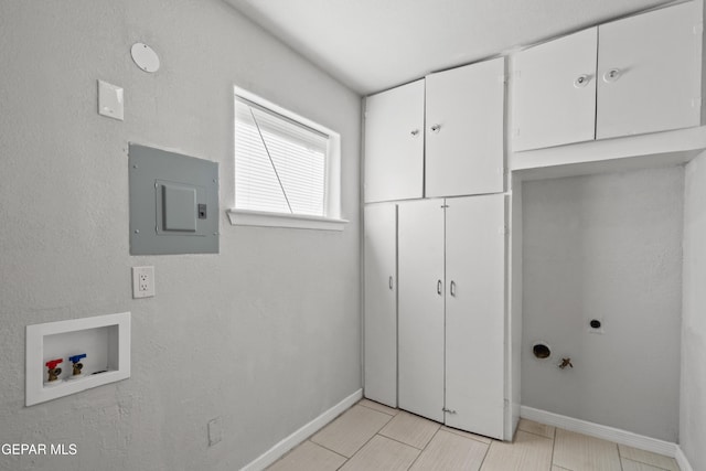 laundry room featuring washer hookup, electric panel, cabinets, hookup for an electric dryer, and light tile patterned floors