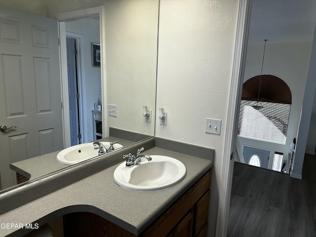 bathroom featuring vanity and wood-type flooring