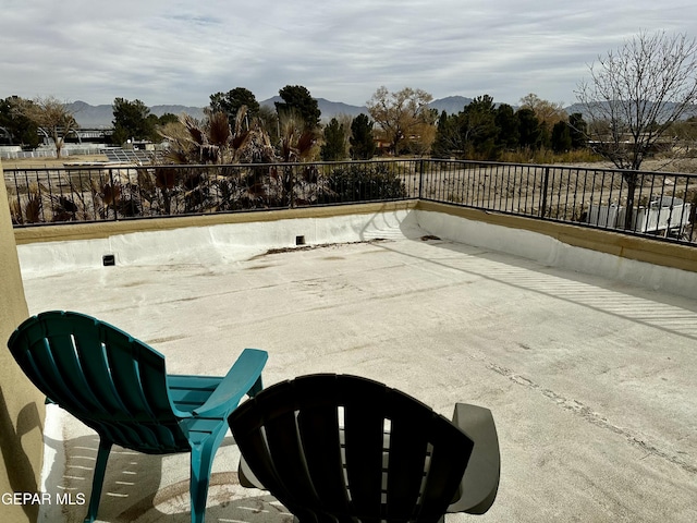 view of patio / terrace featuring a mountain view