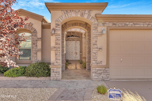 view of exterior entry featuring a garage