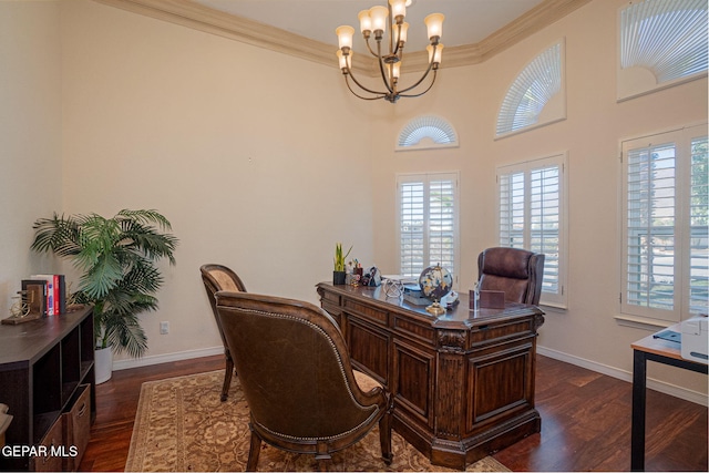 office area featuring ornamental molding, plenty of natural light, dark wood-type flooring, and a notable chandelier