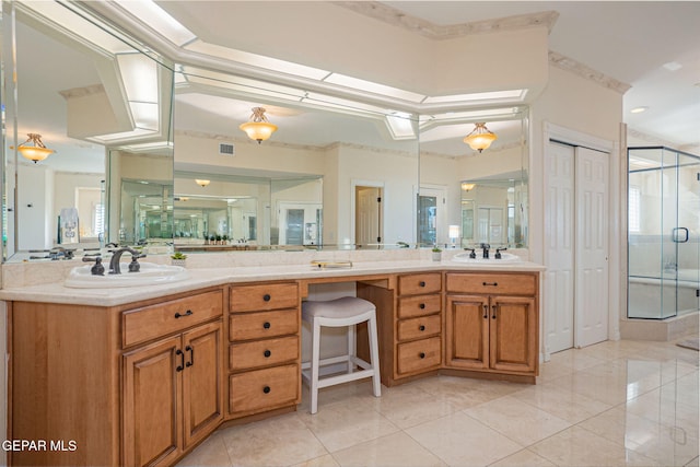 bathroom featuring tile patterned floors, vanity, and walk in shower