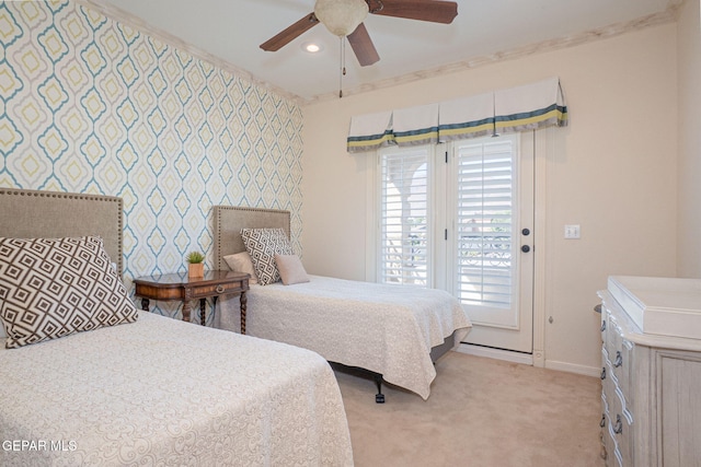 carpeted bedroom with ceiling fan, access to exterior, and ornamental molding