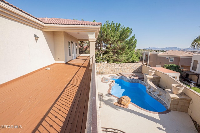 view of swimming pool featuring a mountain view