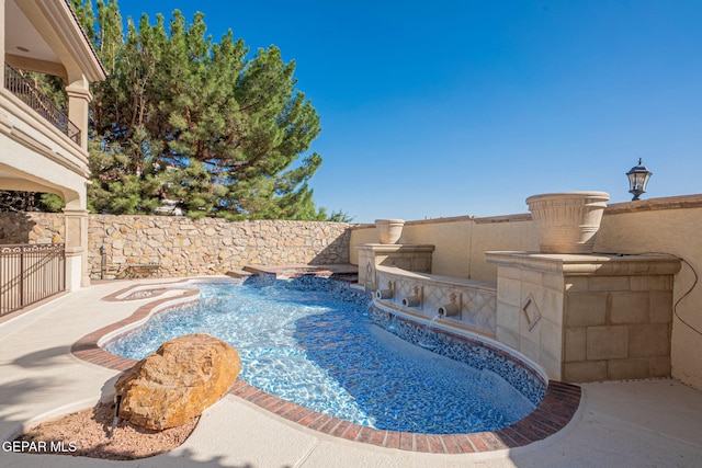 view of pool with pool water feature