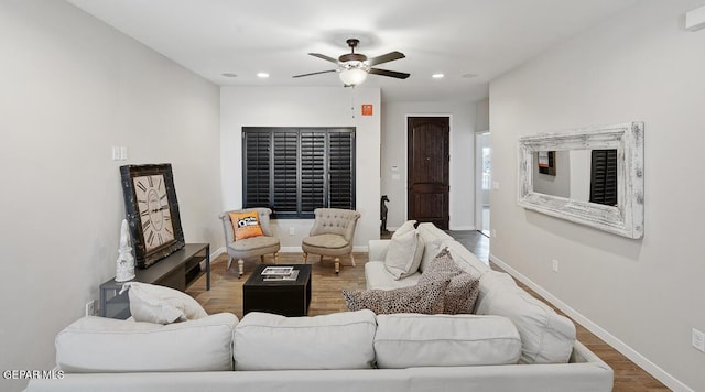 living room featuring hardwood / wood-style flooring and ceiling fan