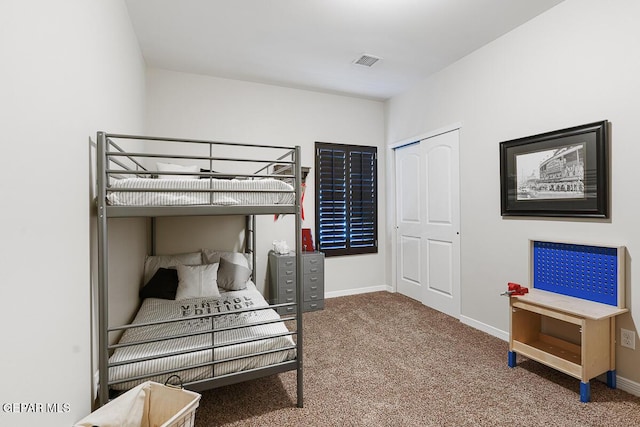 carpeted bedroom with a closet