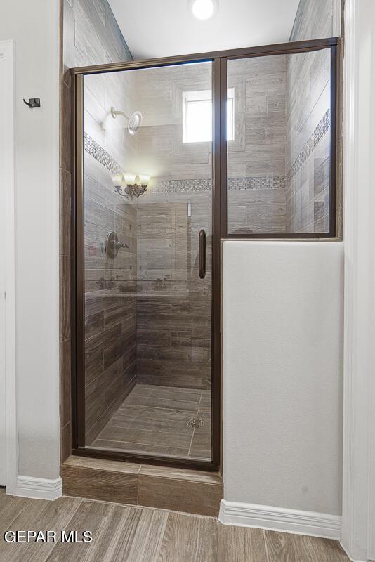 bathroom featuring an enclosed shower