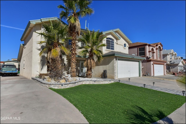 view of front facade featuring a front lawn and a garage