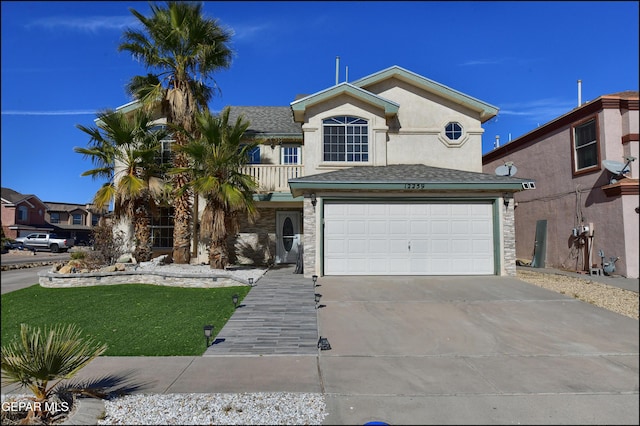 front of property with a balcony, a front lawn, and a garage