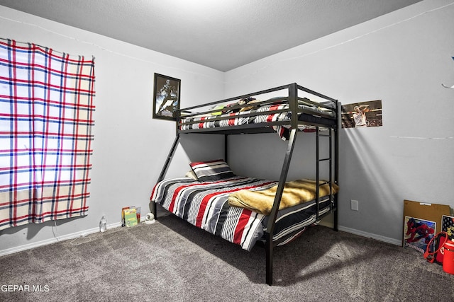 carpeted bedroom featuring a textured ceiling