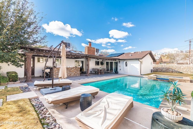 view of pool featuring an in ground hot tub and a patio area