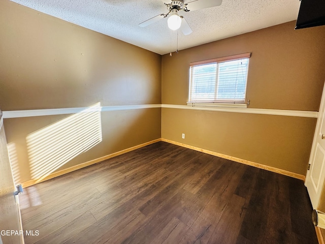 spare room with hardwood / wood-style floors, a textured ceiling, and ceiling fan