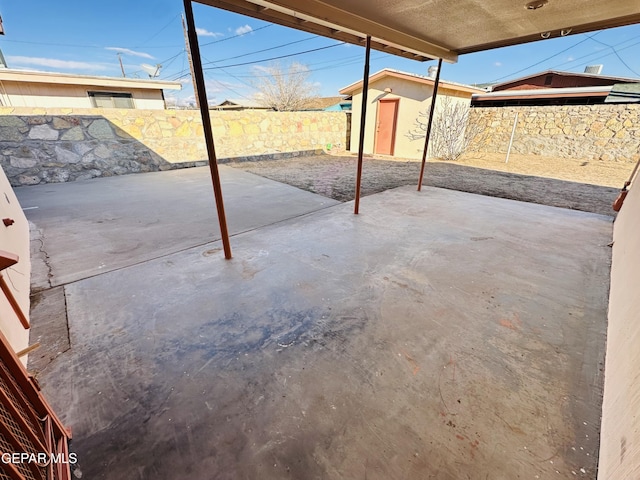 view of patio / terrace featuring a storage shed