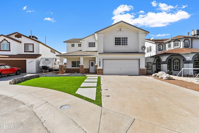 view of front of property featuring a front yard and a garage