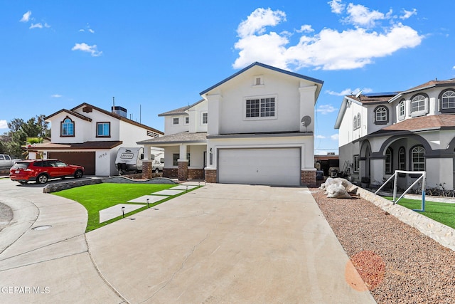 view of front of house with a front yard, solar panels, and a garage