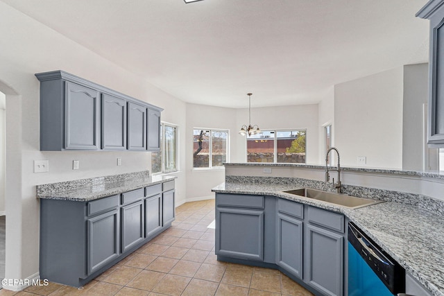 kitchen featuring sink, stone countertops, a notable chandelier, light tile patterned flooring, and stainless steel dishwasher