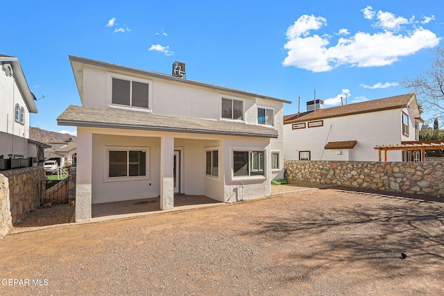 rear view of house featuring a patio