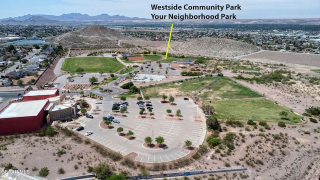 birds eye view of property with a mountain view