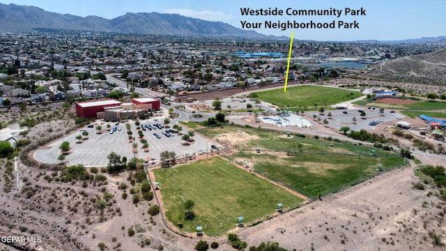 birds eye view of property with a mountain view