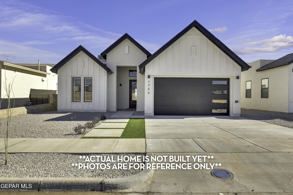 modern farmhouse style home featuring a garage