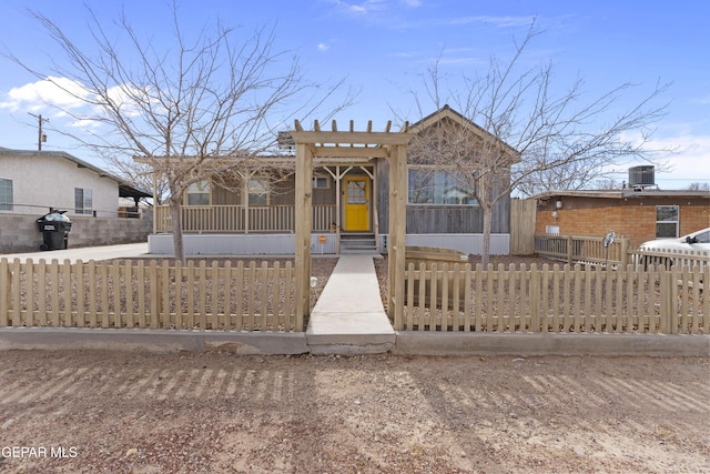 view of front of property with a porch and central air condition unit