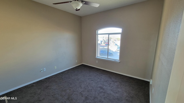 carpeted empty room featuring ceiling fan