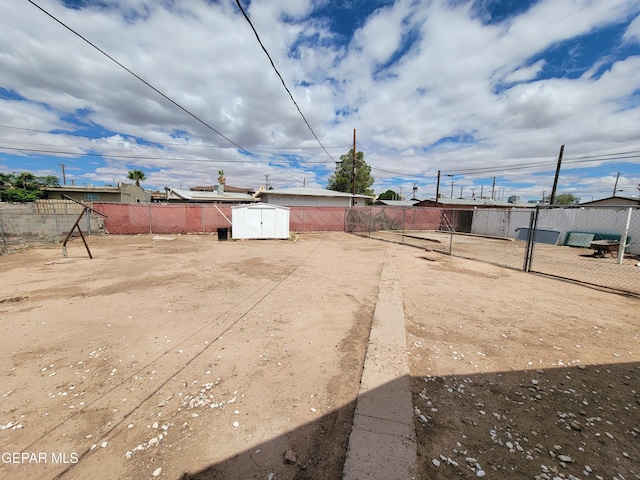 view of yard with a storage unit