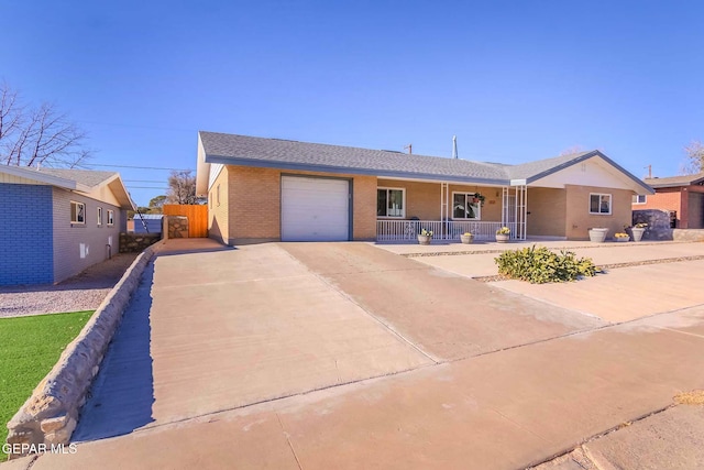 ranch-style house with covered porch and a garage