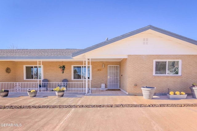 ranch-style home featuring covered porch