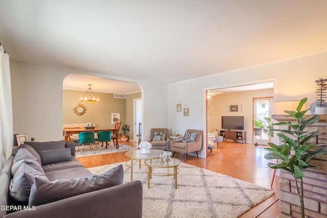 living room featuring hardwood / wood-style flooring and a chandelier