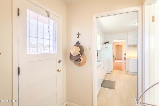 doorway to outside featuring light hardwood / wood-style floors