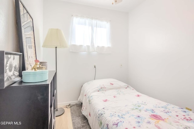 bedroom with hardwood / wood-style floors