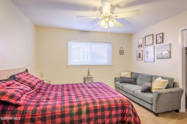 bedroom featuring ceiling fan and light carpet