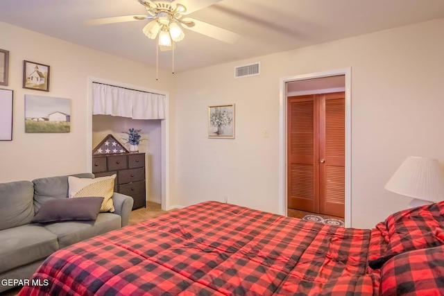 carpeted bedroom with a closet and ceiling fan