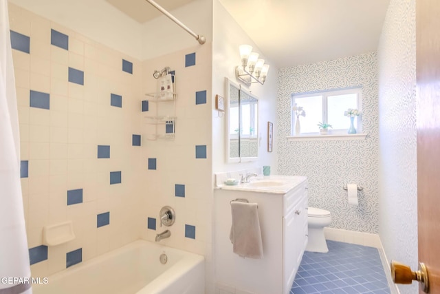 full bathroom with tile patterned floors, vanity, toilet, and shower / bath combo with shower curtain