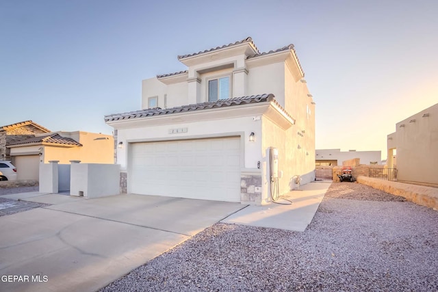 mediterranean / spanish-style house featuring a garage