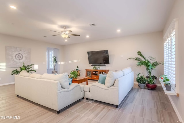 living room featuring ceiling fan