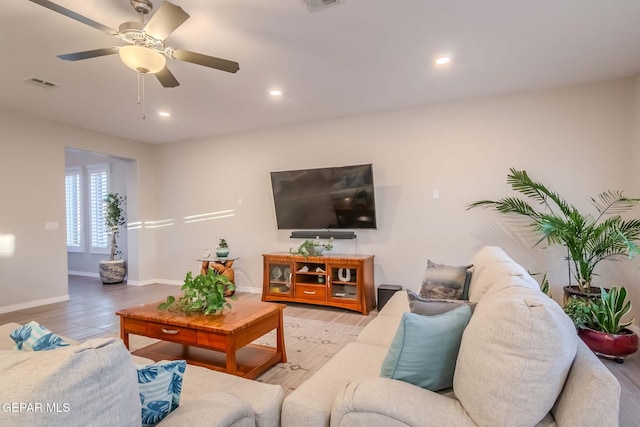 living room featuring ceiling fan