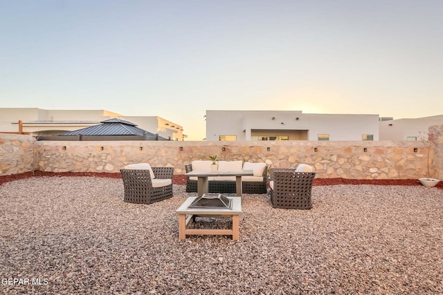 yard at dusk with an outdoor fire pit