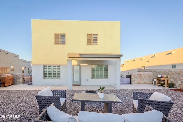 rear view of property featuring a patio area