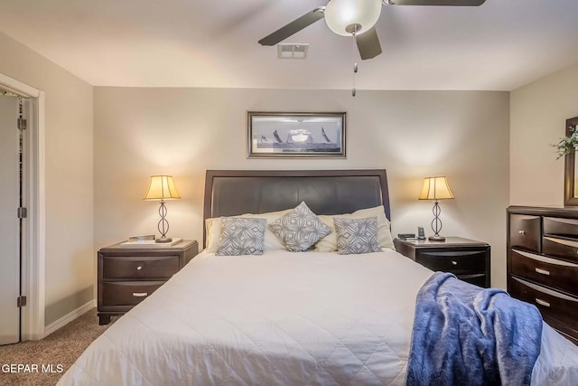 carpeted bedroom with ceiling fan