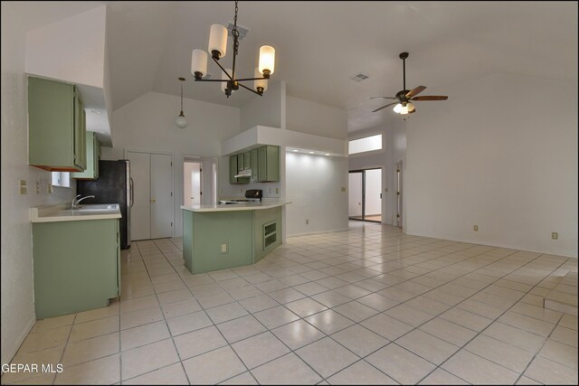 kitchen featuring ceiling fan with notable chandelier, high vaulted ceiling, green cabinets, range, and light tile patterned floors